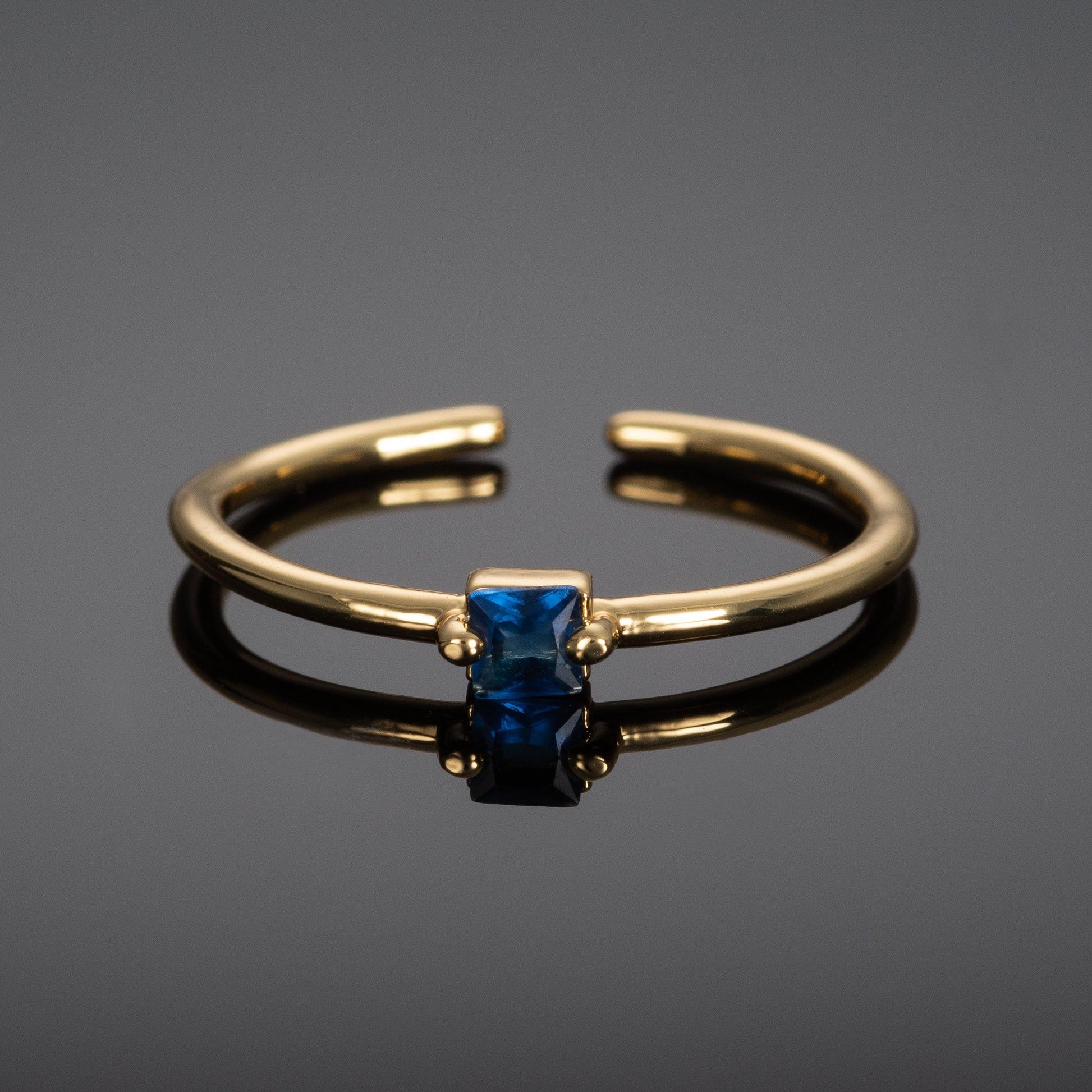 Adjustable Gold Plated Ring for Women with a Blue Cubic Zirconia Stone - namana.london