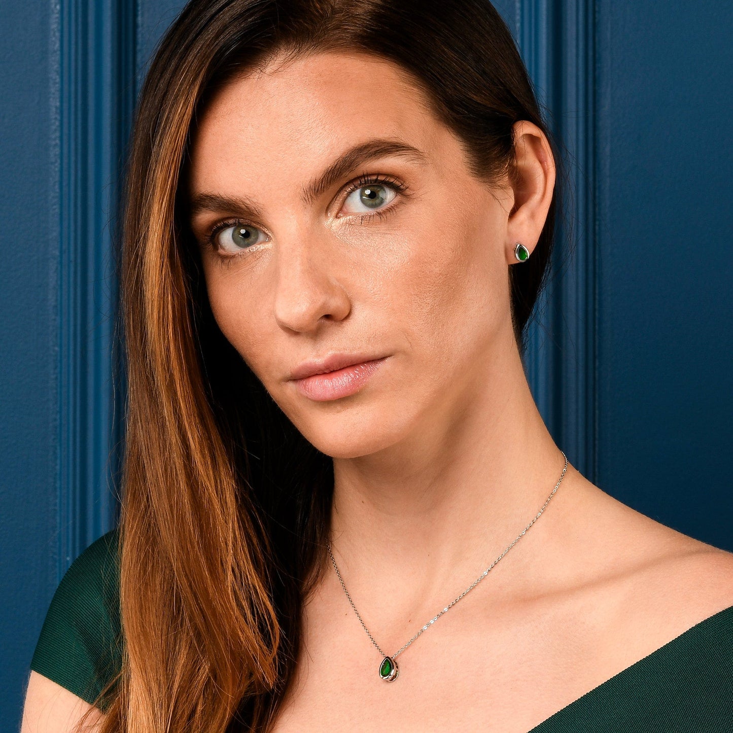 Silver Green Bezel Set Stud Earrings with Pear-Shaped Green Cubic Zirconia Stones