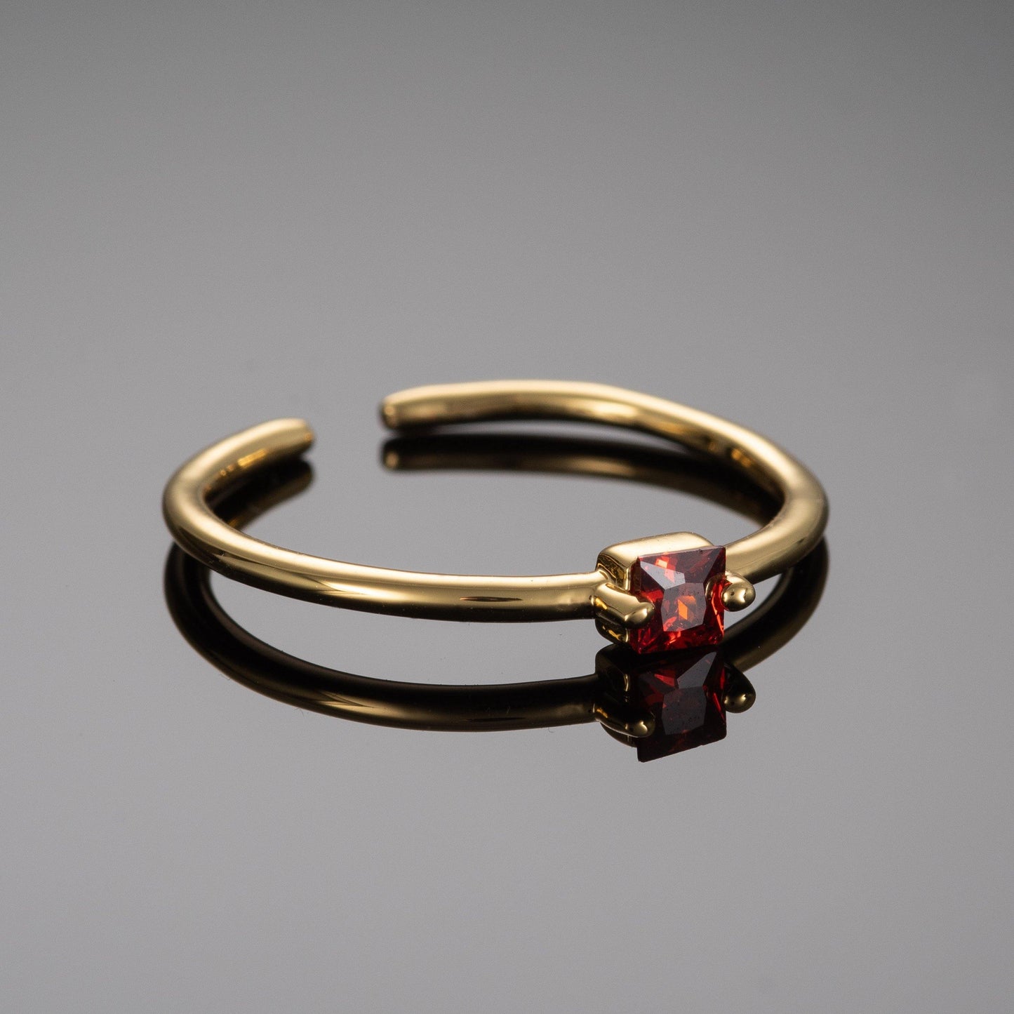Adjustable Gold Plated Ring for Women with a Red Cubic Zirconia Stone - namana.london