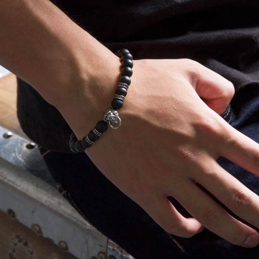 Black Bead Stretch Bracelet for Men with a Lion Head - namana.london